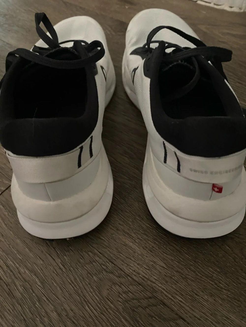 On Running Men’s White and Black Athletic Running Shoes